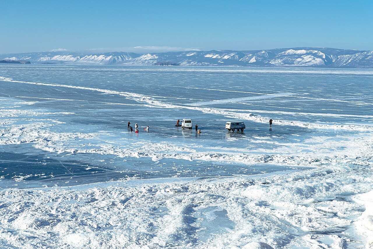The frozen surface of Lake Baikal covered in snow and ice