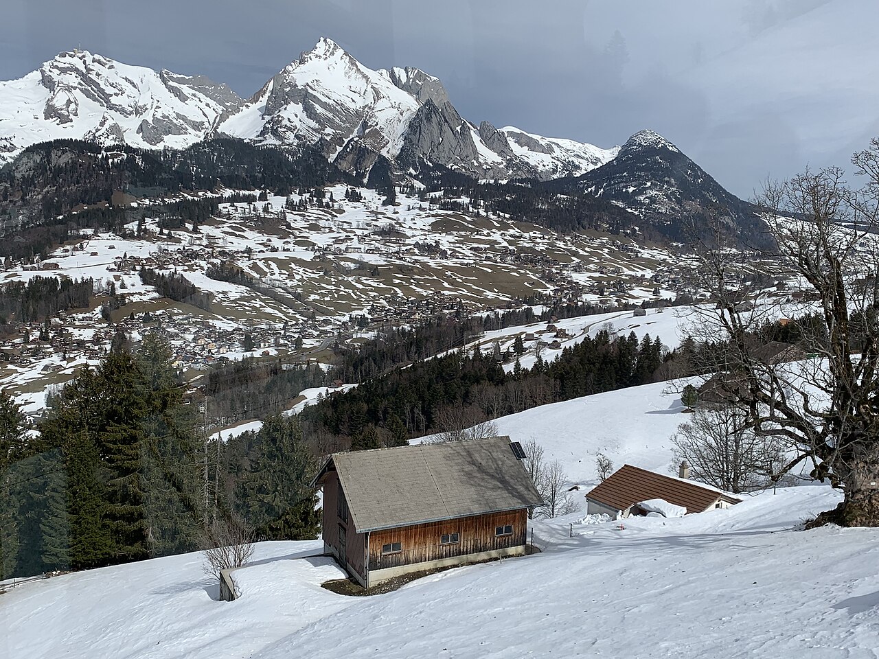 A small mountain hut surrounded by snow in the Swiss Alps